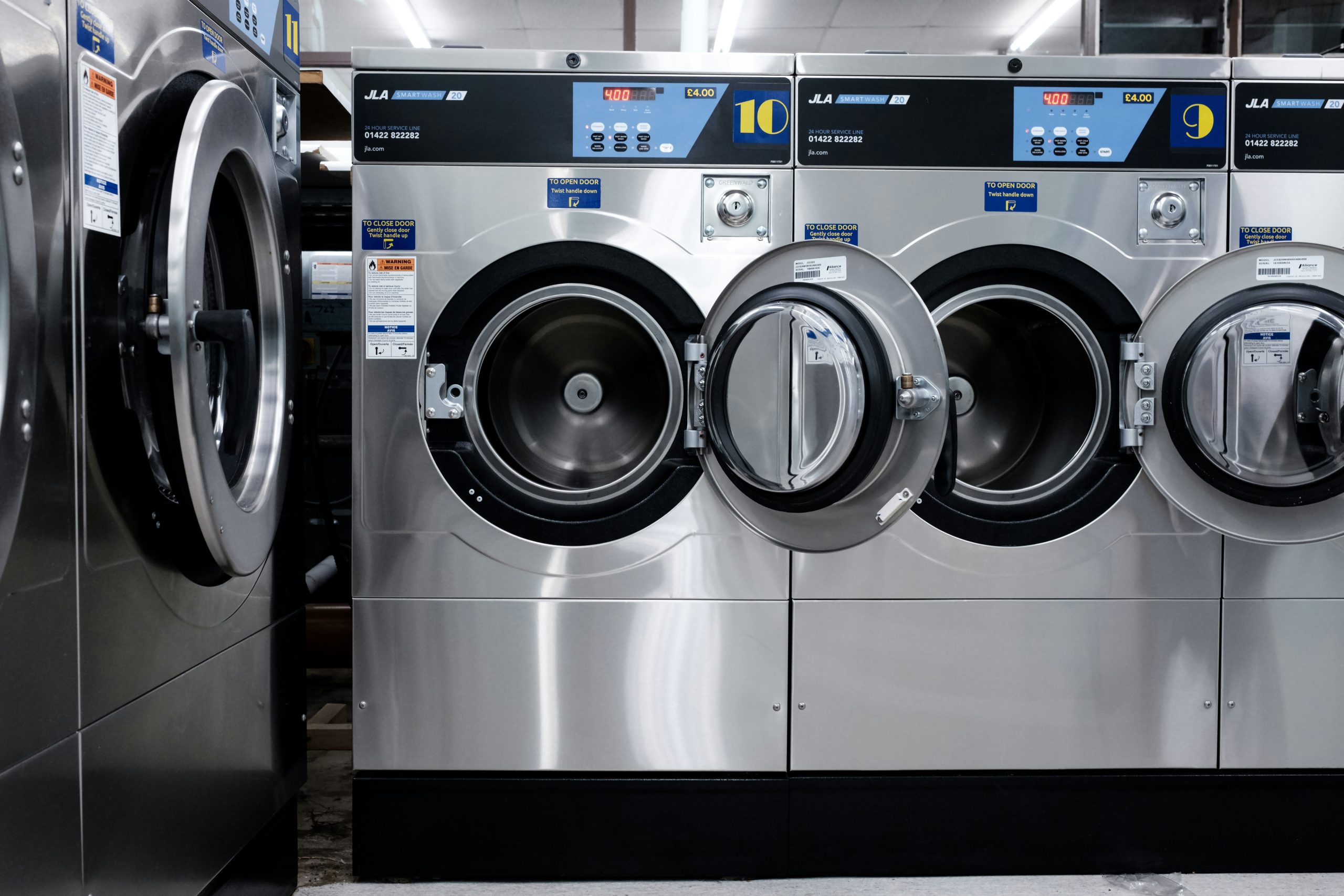 Customer comparing cost at laundrette prices with online laundry delivery service in the UK